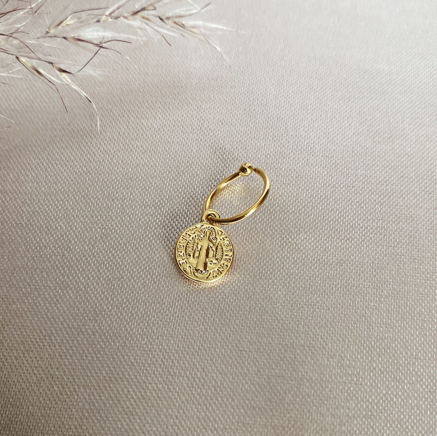 Piercing Medalla San Benito